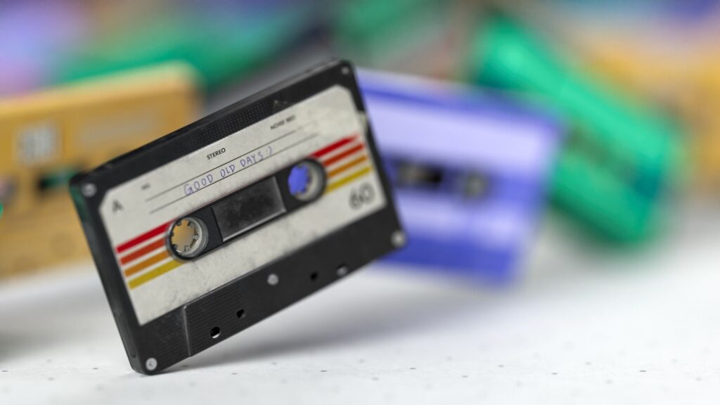 An old fashioned cassette is laying on a table