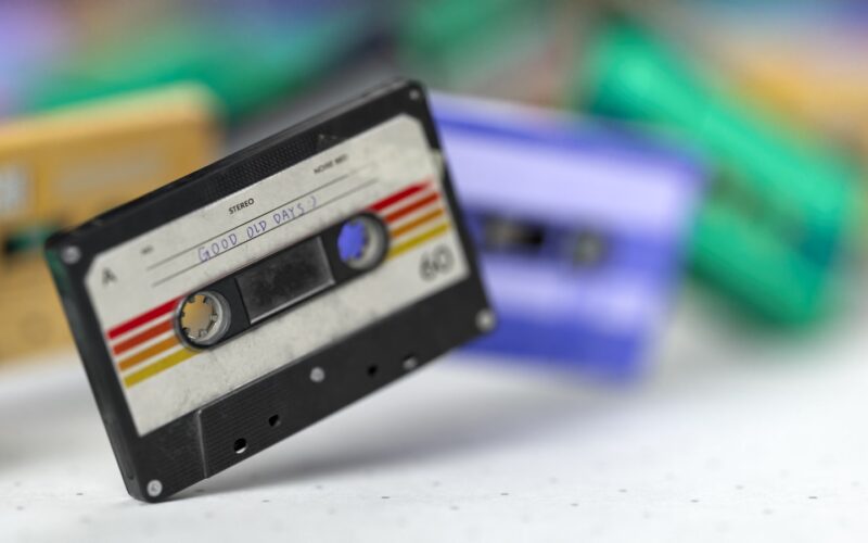 An old fashioned cassette is laying on a table