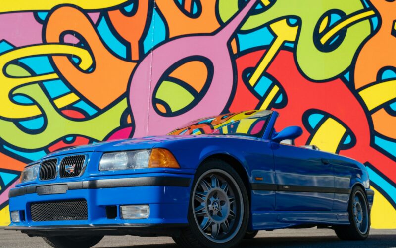 blue chevrolet camaro on road