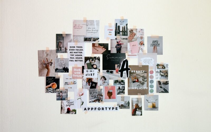a collage of pictures and words on a white wall